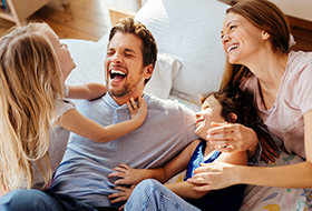 family of 4 on couch